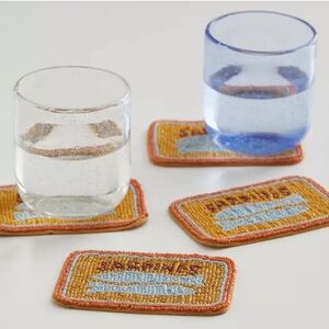 URBAN OUTFITTERS Home Sardine Beaded
Coaster Set of 4